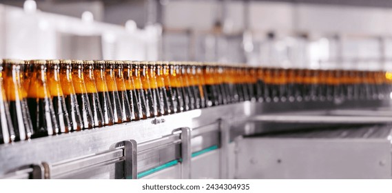 Dark Beer Bottles, rows of glass production alcohol on industrial conveyor belt, banner. - Powered by Shutterstock