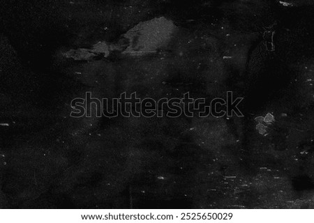 Dark black background with a grunge texture. The black background features subtle scratches and speckles for a distressed look. Dark and black background. Grunge concrete texture wall background.