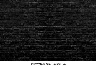 Dark black brick wall Is the background of the room that has textures Of old antique plaster grunge