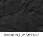 Dark black grey paper background creased crumpled surface. Old torn ripped posters scary grunge textures backdrop