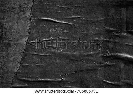 Dark black paper background creased crumpled surface / Old torn ripped posters grunge textures placard