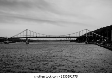Dark black pedestrian bridge in Kiev