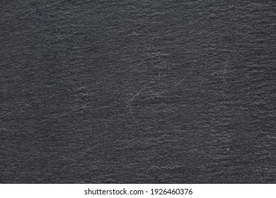 Dark Black Rock Slate For Serving Food Background Or Texture Macro Shot.