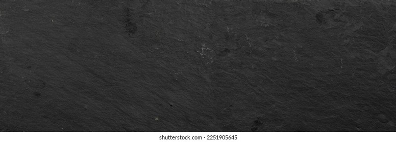 Dark black slate background or slate texture