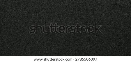 Dark black textile texture with subtle woven pattern and matte fabric surface for luxury branding and modern design layouts