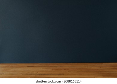 Dark blue background for copy space and wooden table