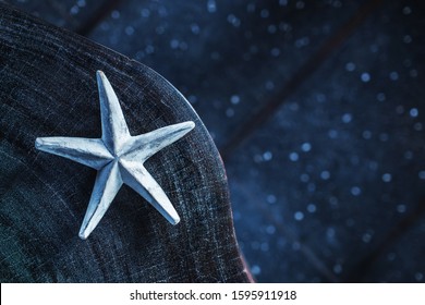 Dark Blue Background With One White Handmade Star, Empty Place And Copy Space. Trendy Eco Concept. Wooden Element In Home Decor And Furniture.