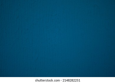 Dark blue background, with a texture of facade plaster