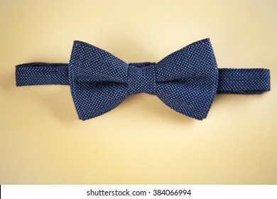 Dark Blue Bow Tie On Beige Background