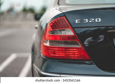 Dark Blue Car Vehicle Tail Light On The Parking Spot