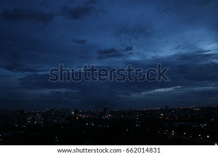 dark blue cloud with white light sky background and city light midnight evening time  