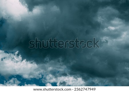 Dark Blue Cloudy Rainy Sky With Rain Heavy Clouds. Storm, Thunder, Thunderstorm, Storm clouds. Sky Natural Background. Cumulonimbus Cloud. Strange Clouds Cloud Sky. Weather Forecast Concept. Heavy
