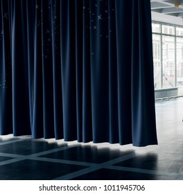 Dark blue curtain dividing the room - Shutterstock ID 1011945706