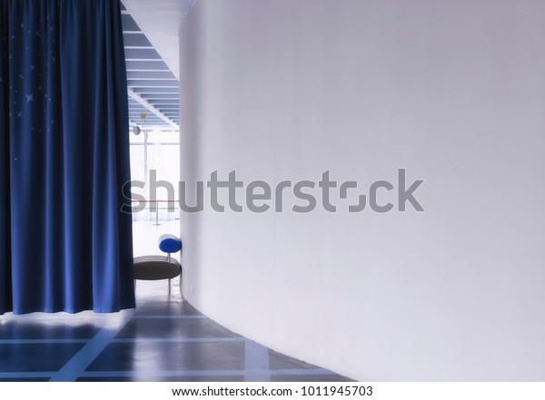 Dark blue curtain dividing\
the room