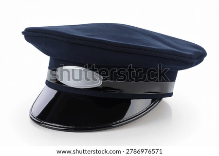 Dark blue driver peak cap with blank silver badge isolated on white background