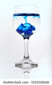 Dark Blue Dye Exploding In A Wineglass