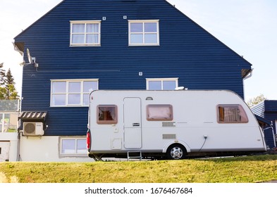 Dark Blue Family House With A Camper For Travel, The Theme Of Buildings And Backgrounds
