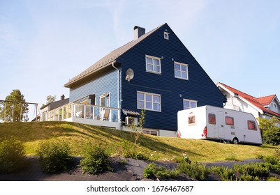 Dark Blue Family House With A Camper For Travel, The Theme Of Buildings And Backgrounds
