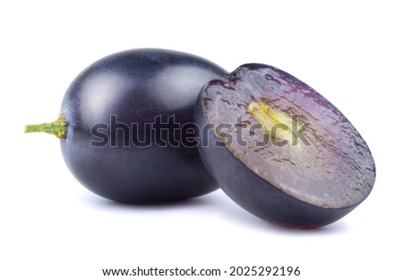 Dark blue grapes and grape slices isolated on white background.