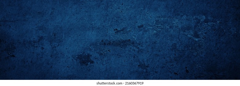    Dark blue grunge texture. Toned rough wall surface. Background with space for design. Web banner. Wide. Panoramic.                            