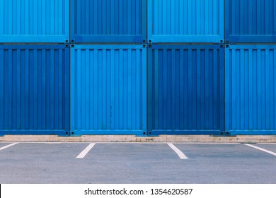 Dark Blue And Light Blue Containers And Parking Spots