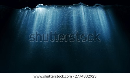 Dark Blue Ocean Surface Seen from Underwater. Abstract Waves and Rays of Sunlight Shining Through
