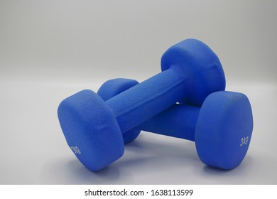 Dark Blue Rubber Coated Dumbells Isolated In White Background