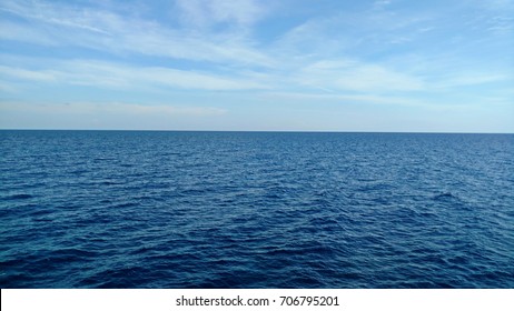 Dark blue sea and light blue sky.
Deep blue water. - Powered by Shutterstock