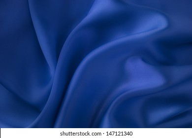 Dark blue silk fabric background - soft, elegant and delicate