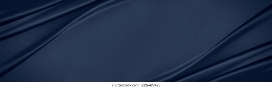 Dark blue silk satin. Soft folds. Fabric. Navy blue luxury background. Space for design.Wavy lines.Banner. Wide.Long. Flat lay, top view table. Beautiful. Elegant. Birthday, Christmas, Valentine's Day - Shutterstock ID 2226497423