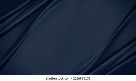 Dark blue silk satin. Soft folds. Fabric. Navy blue luxury background. Space for design.Wavy lines. Banner. Flat lay, top view table. Beautiful. Elegant. Birthday, Christmas, Valentine's Day.