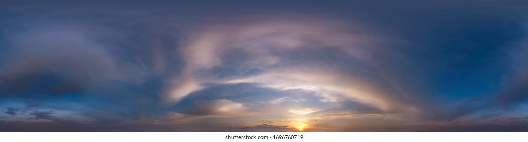 dark blue sky before sunset with beautiful awesome clouds. Seamless hdri panorama 360 degrees angle view with zenith for use in graphics or game development as sky dome or edit drone shot