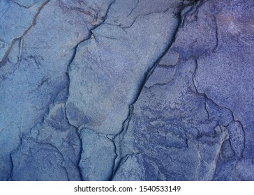 Dark blue slate background. Natural colorful texture                               