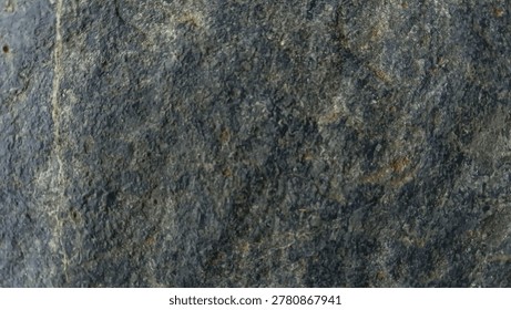 A dark blue stone texture with cloudy patterns and scattered rusty specks.