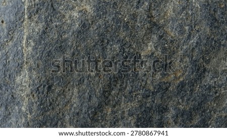 A dark blue stone texture with cloudy patterns and scattered rusty specks.