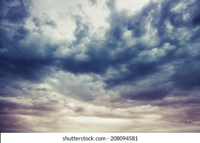 Dark blue stormy cloudy sky natural photo background with Instagram toned effect - Shutterstock ID 208094581