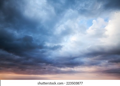 Dark blue stormy cloudy sky. Natural photo background