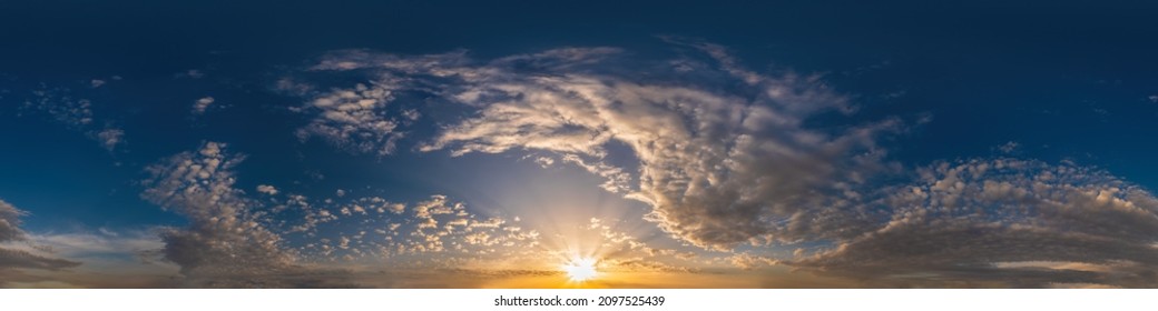 Dark blue sunset sky pano with Cumulus clouds. Seamless hdr panorama in spherical equirectangular format. Complete zenith for 3D visualization, game and sky replacement for aerial drone 360 panoramas.