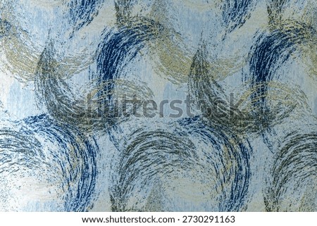 Dark blue textile texture with a repeating wavy pattern and integrated gold lurex threads. Woven fabric surface shot in close-up. Suitable for background use, web design, and textile mockups