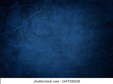 Dark Blue Textured Background With Highlight In The Center