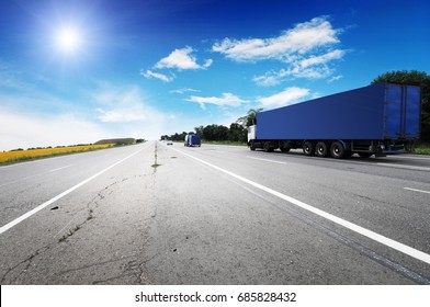 Dark Blue Truck Delivering Badges On The Highway