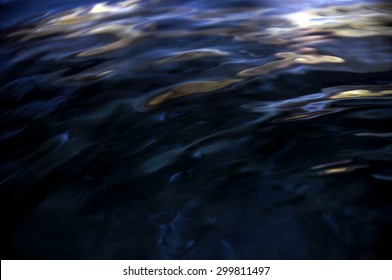 Dark Blue water wave and reflection. soft focus and blur