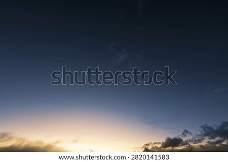 Dark Blue To Yellow Gradient Twilight Afterglow Sky With Clouds