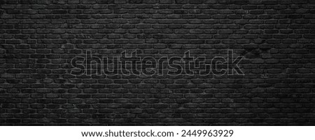 dark brick wall background, damaged black stone brickwork