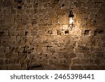 Dark brick wall background with an old lantern. 