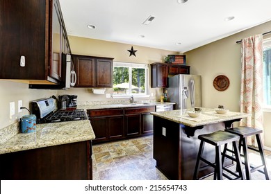 Dark Brown Cabinets With Granite Tops. Kitchen Island With Stools