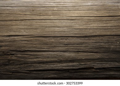 dark brown color backdrop of old retro vintage aged wooden texture background with crack and snag Dramatic dusk luxury light
