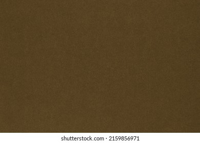 Dark brown colored paper texture. Textured surface with cellulose fibers.Tobacco coloured background or wallpaper