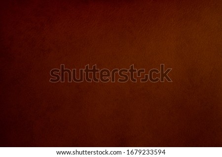 Dark brown leather texture background surface.
