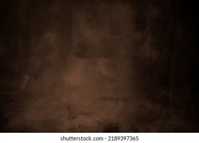 Dark brown painted background with black shadows on both sides. - Shutterstock ID 2189397365